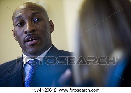 Close-up of an African businessman View Large Photo Image Stock Image - Close-up of an African businessman. Fotosearch