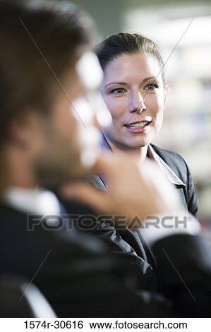 Stock Photograph - Close-up of business people in an office. Fotosearch