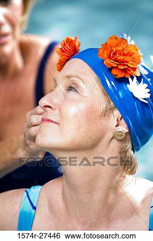 Close-up of senior women in a swimming pool View Large Photo Image Stock Photograph - Close-up of senior women in a swimming pool. Fotosearch