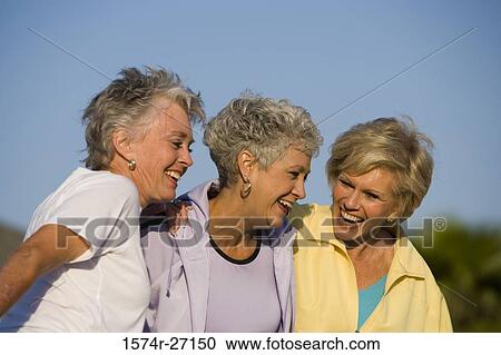 Stock Image - Close-up of three cheerful senior women. Fotosearch