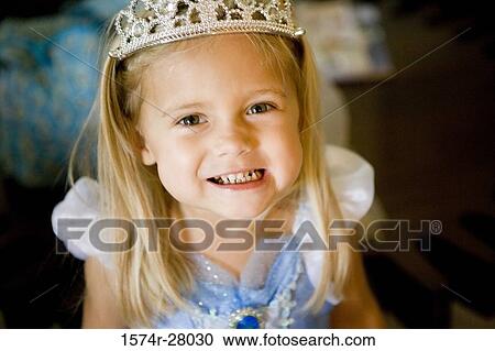 Close-up portrait of a girl wearing tiara and clenching teeth View Large Photo Image Stock Image - Close-up portrait of a girl wearing tiara and clenching teeth. Fotosearch