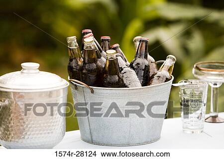 Collection of bottles in bucket View Large Photo Image Picture - Collection of bottles in bucket. Fotosearch