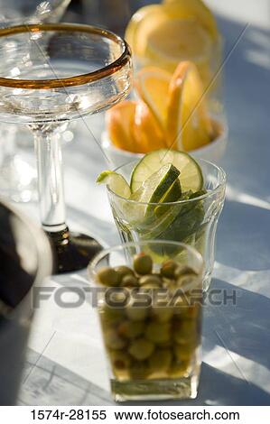 Stock Photography - Collection of lemons in transparent glasses. Fotosearch