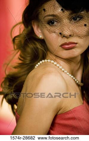 Confused young prostitute wearing veil and a necklace View Large Photo Image Stock Image - Confused young prostitute wearing veil and a necklace. Fotosearch