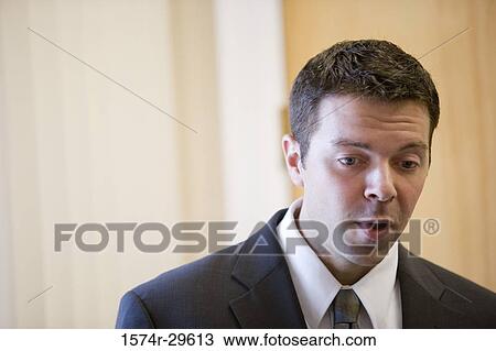 Contemplative businessman in an office View Large Photo Image Stock Image - Contemplative businessman in an office. Fotosearch