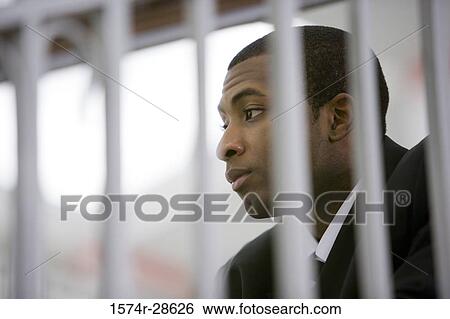 Stock Photograph - Contemplative businessman sitting on staircase. Fotosearch