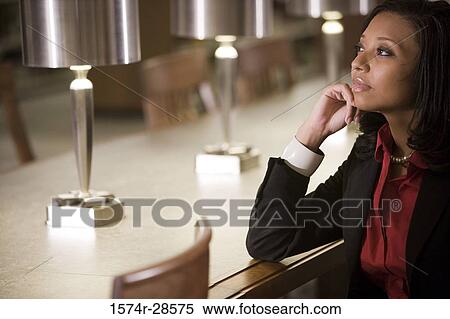 Contemplative businesswoman in an office View Large Photo Image Stock Photography - Contemplative businesswoman in an office. Fotosearch