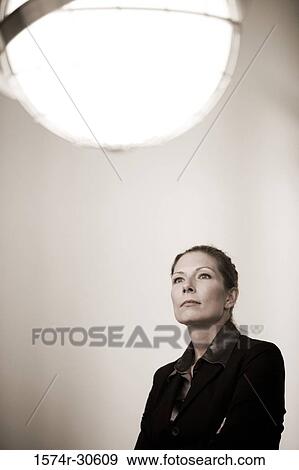 Contemplative businesswoman looking up View Large Photo Image Stock Photo - Contemplative businesswoman looking up. Fotosearch