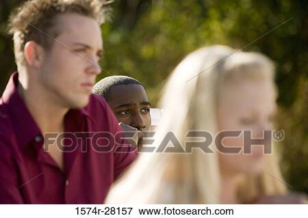 Contemplative friends looking away View Large Photo Image Stock Photo - Contemplative friends looking away. Fotosearch