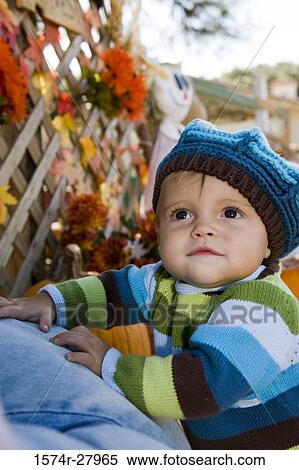 Cute boy in warm clothing looking up View Large Photo Image Stock Photography - Cute boy in warm clothing looking up. Fotosearch