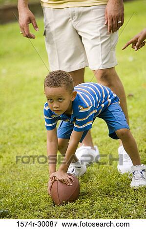 Stock Photo - Father playing with his son at park. Fotosearch