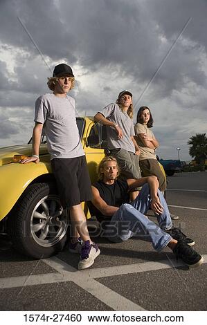 Friends by a car at the parking area View Large Photo Image Stock Image - Friends by a car at the parking area. Fotosearch