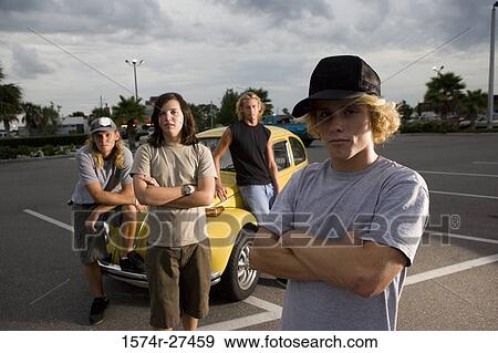 Friends by a car at the parking area View Large Photo Image Stock Photo - Friends by a car at the parking area. Fotosearch