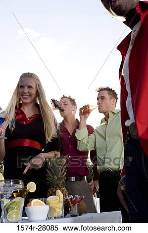 Friends enjoying wine in party View Large Photo Image Stock Photography - Friends enjoying wine in party. Fotosearch