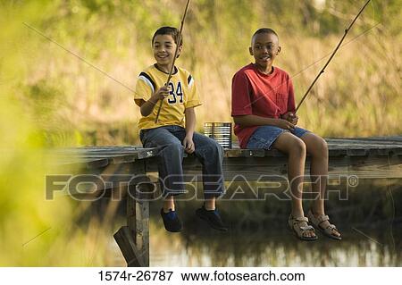 Friends fishing with fishing rods at the lake View Large Photo Image Stock Photo - Friends fishing with fishing rods at the lake. Fotosearch