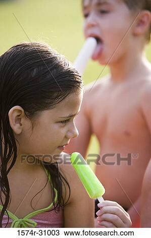 Girl holding flavored ice View Large Photo Image Stock Image - Girl holding flavored ice. Fotosearch