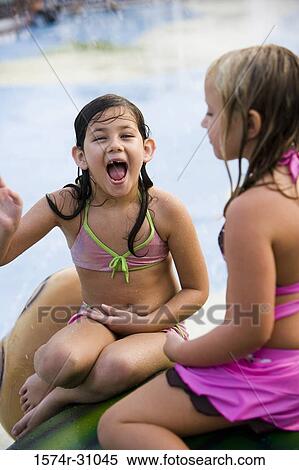 Girl sitting with a friend View Large Photo Image Stock Photography - Girl sitting with a friend. Fotosearch