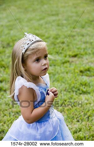 Stock Image - Girl wearing tiara and looking away. Fotosearch