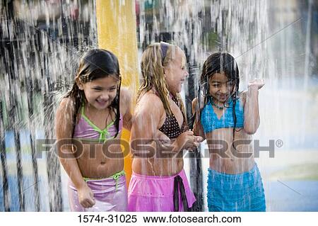 Girls standing together under a shower View Large Photo Image Stock Photography - Girls standing together under a shower. Fotosearch