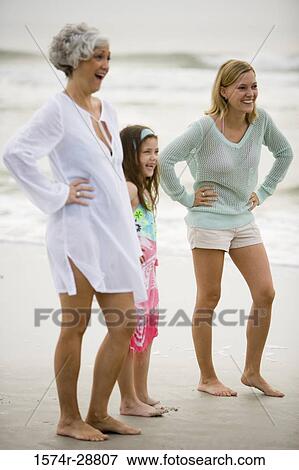 Grandmother enjoying with her daughter and granddaughter at the beach View Large Photo Image Stock Photo - Grandmother enjoying with her daughter and granddaughter at the beach. Fotosearch