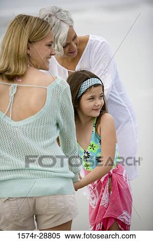 Grandmother enjoying with her daughter and granddaughter at the beach View Large Photo Image Stock Photography - Grandmother enjoying with her daughter and granddaughter at the beach. Fotosearch