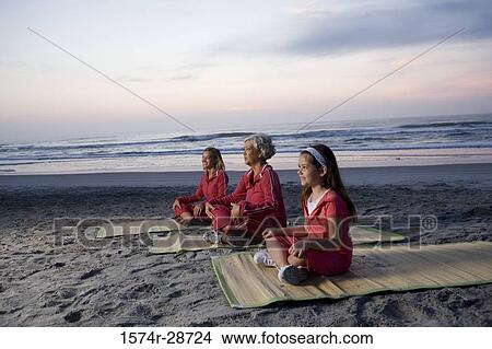 Grandmother with her daughter and granddaughter exercising at the beach View Large Photo Image Picture - Grandmother with her daughter and granddaughter exercising at the beach. Fotosearch