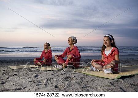 Grandmother with her daughter and granddaughter exercising at the beach View Large Photo Image Stock Image - Grandmother with her daughter and granddaughter exercising at the beach. Fotosearch