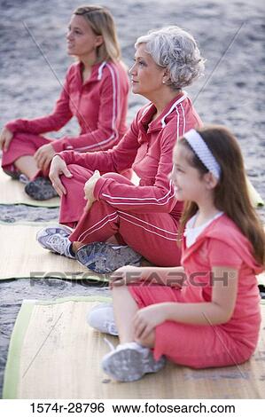 Grandmother with her daughter and granddaughter exercising at the beach View Large Photo Image Stock Photograph - Grandmother with her daughter and granddaughter exercising at the beach. Fotosearch