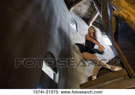 Stock Photography - Low angle view of a ballet dancer practicing on a wooden staircase. Fotosearch