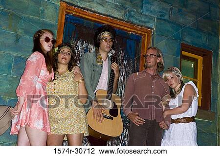 Low angle view of a family standing together by wall View Large Photo Image Stock Image - Low angle view of a family standing together by wall. Fotosearch