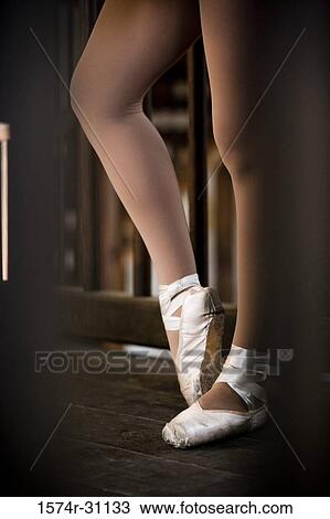 Low section of a ballet dancer standing View Large Photo Image Stock Image - Low section of a ballet dancer standing. Fotosearch