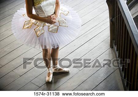 Stock Photo - Low section of a ballet dancer standing. Fotosearch