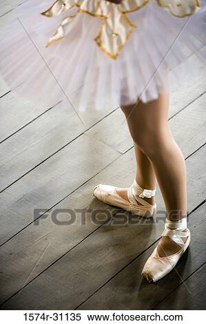 Low section of a ballet dancer standing View Large Photo Image Stock Photography - Low section of a ballet dancer standing. Fotosearch