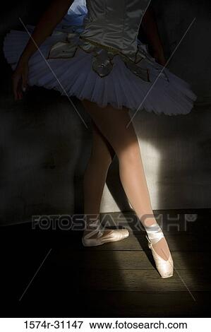 Low section of a woman practicing ballet dancing View Large Photo Image Stock Photo - Low section of a woman practicing ballet dancing. Fotosearch