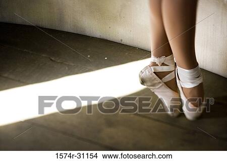 Picture - Low section of a young woman practicing ballet dancing. Fotosearch