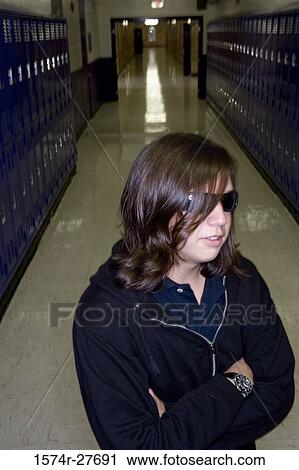 Male student wearing sunglasses and standing by lockers View Large Photo Image Stock Image - Male student wearing sunglasses and standing by lockers. Fotosearch