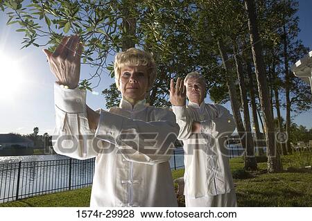 Stock Photo - Mature couple practicing martial arts. Fotosearch