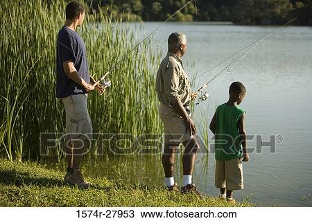 Mature man fishing with his son and friend by lake View Large Photo Image Stock Image - Mature man fishing with his son and friend by lake. Fotosearch