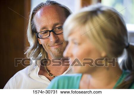 Stock Image - Mature man looking at her wife. Fotosearch