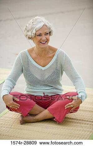 Mature woman exercising at the beach View Large Photo Image Stock Photo - Mature woman exercising at the beach. Fotosearch