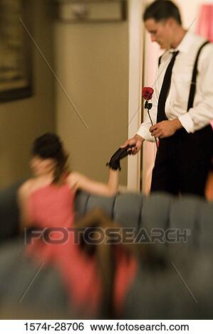 Mid adult man holding hand of a young prostitute View Large Photo Image Stock Photograph - Mid adult man holding hand of a young prostitute. Fotosearch