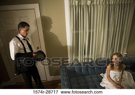 Mid adult man looking at a young prostitute View Large Photo Image Stock Photo - Mid adult man looking at a young prostitute. Fotosearch
