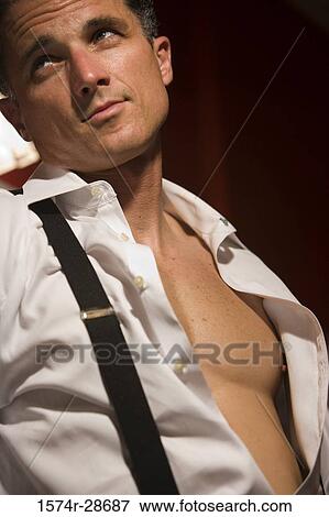 Mid adult man looking away View Large Photo Image Stock Photo - Mid adult man looking away. Fotosearch