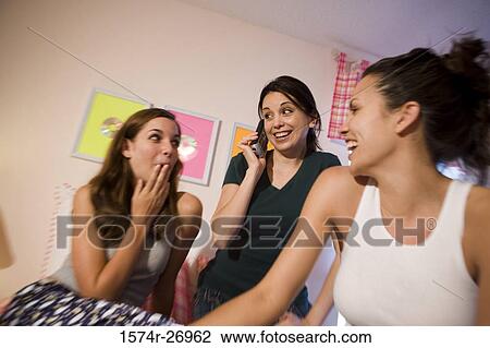 Mother with her daughters smiling in bedroom View Large Photo Image Stock Image - Mother with her daughters smiling in bedroom. Fotosearch
