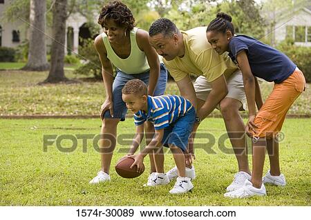 Parents playing with their children at park View Large Photo Image Stock Photo - Parents playing with their children at park. Fotosearch