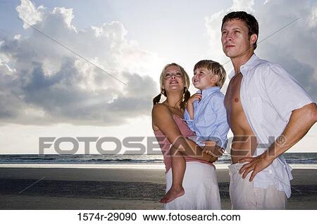 Parents with their son at the beach at the beach View Large Photo Image Stock Image - Parents with their son at the beach at the beach. Fotosearch