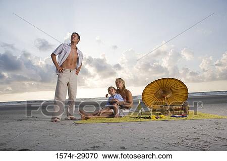 Parents with their son at the beach View Large Photo Image Stock Image - Parents with their son at the beach. Fotosearch