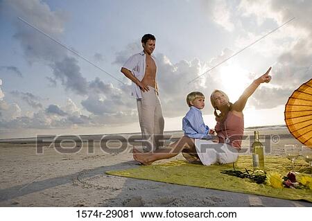 Parents with their son at the beach View Large Photo Image Stock Image - Parents with their son at the beach. Fotosearch