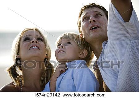 Parents with their son at the beach View Large Photo Image Stock Image - Parents with their son at the beach. Fotosearch