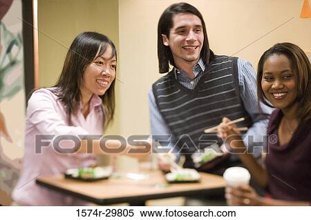People sitting and eating food View Large Photo Image Stock Photography - People sitting and eating food. Fotosearch
